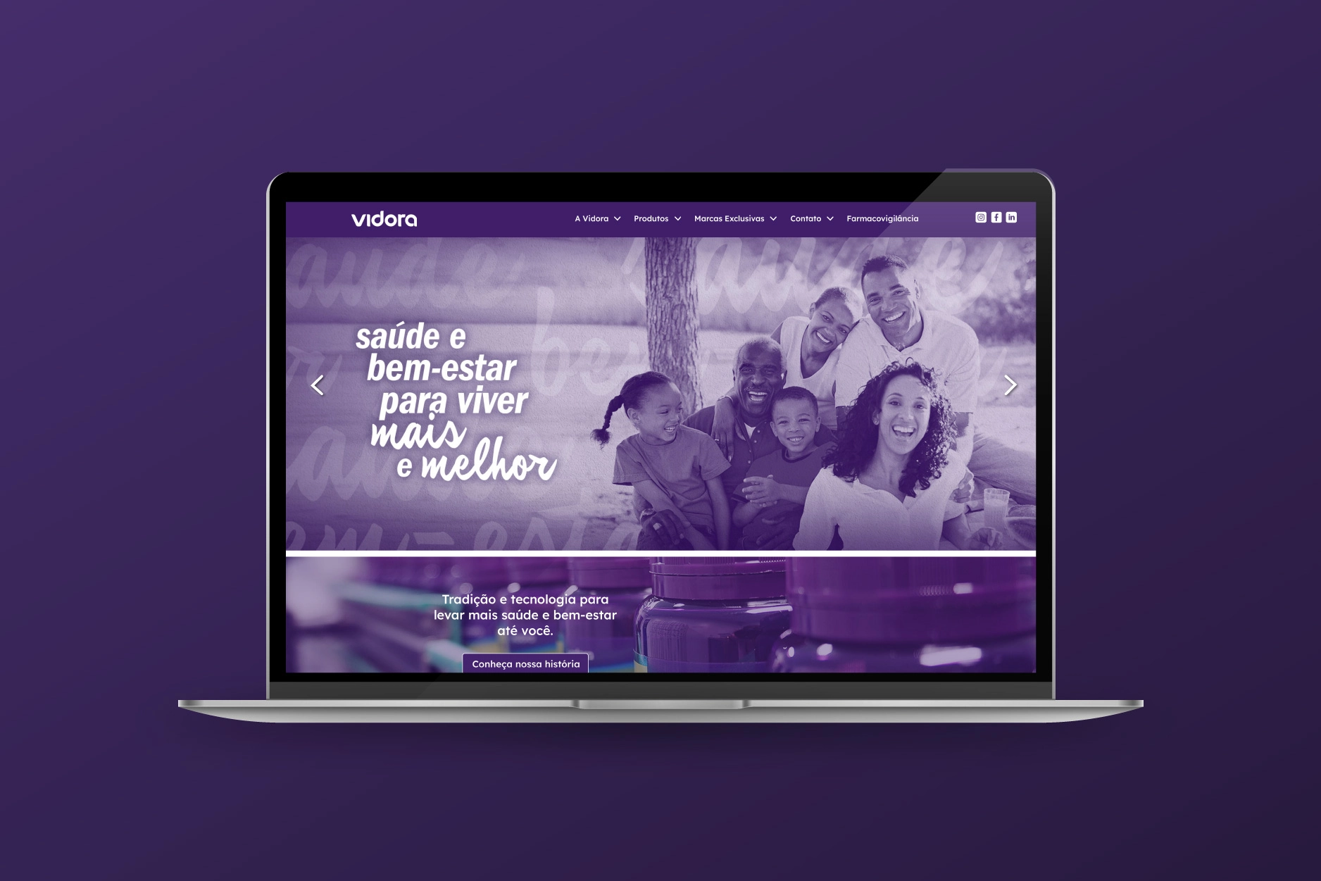 A notebook screen displays the homepage of the Vidora website, which uses a dominant purple color scheme. The main banner features a photograph of a smiling multi-generational family in a park setting overlaid with the text 'Health and well-being to live longer and better'.